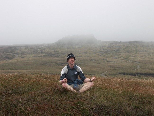 Darryl meditates (?) with Edale Rocks in the background